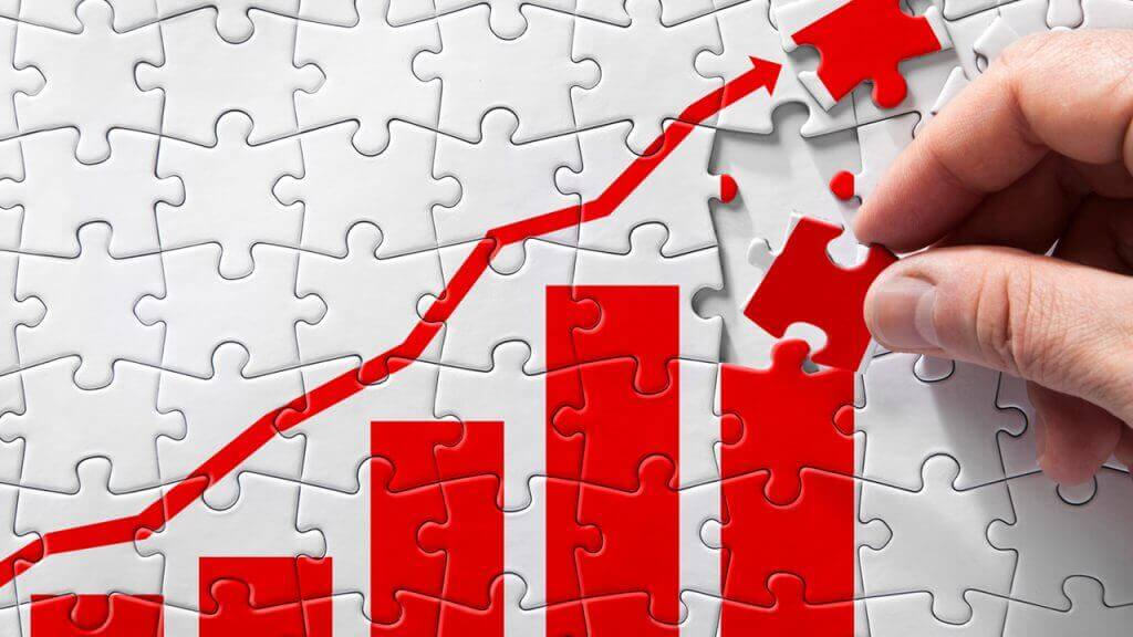 jigsaw pieces being laid in a puzzle illustrating how you conduct forecasting - one piece at a time