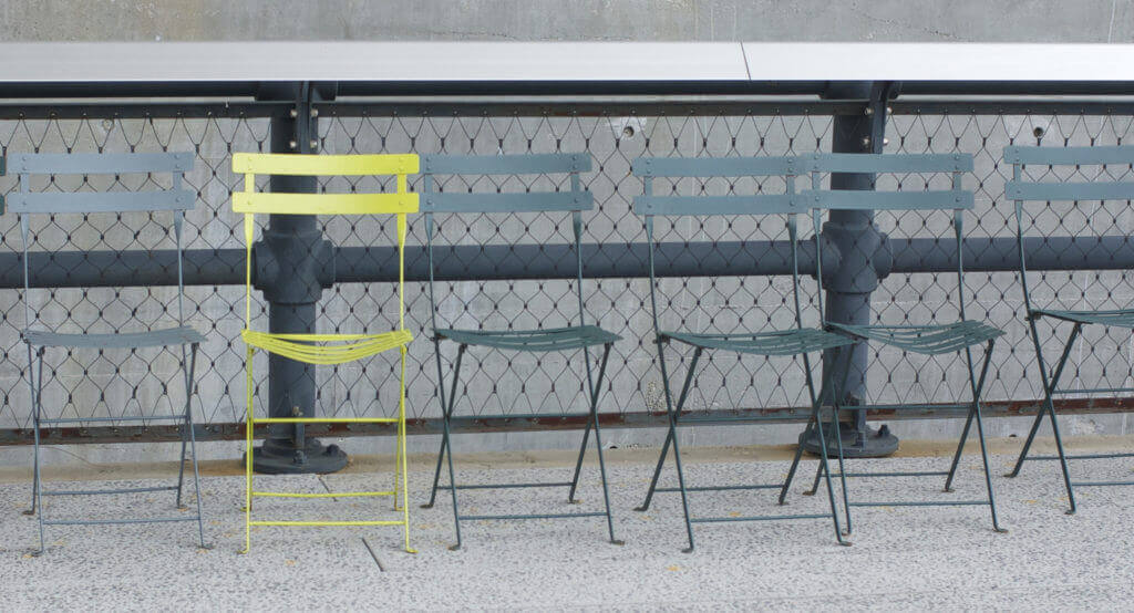 one chair a different colour to others like comparing through benchmarking