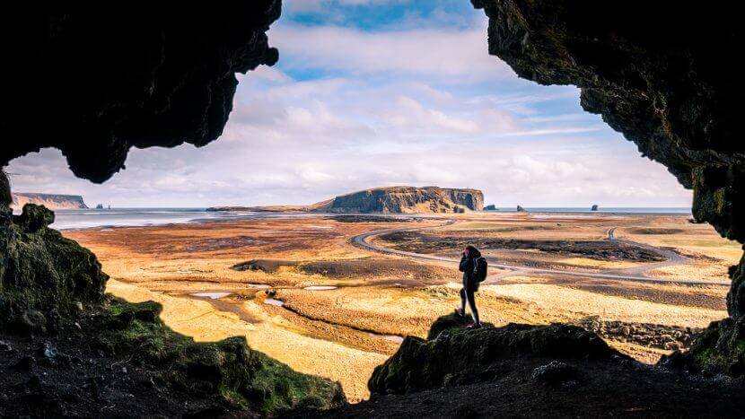 traveler taking a photo of wide open landscape