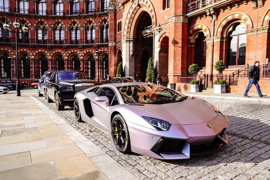 luxury guest cars outside a hotel