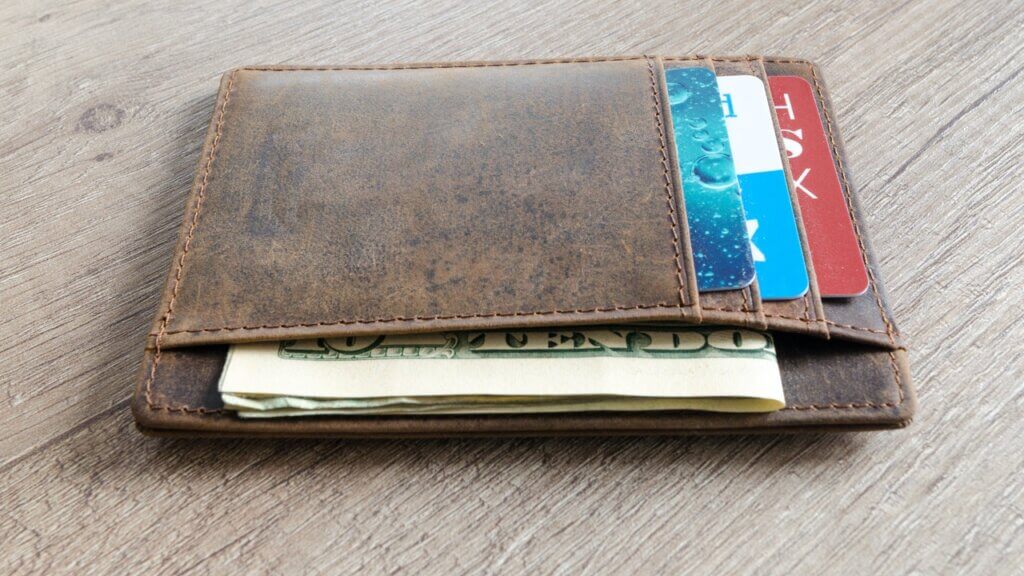 wallet with money and cards reflecting revenue management drive to increase share of wallet per guest