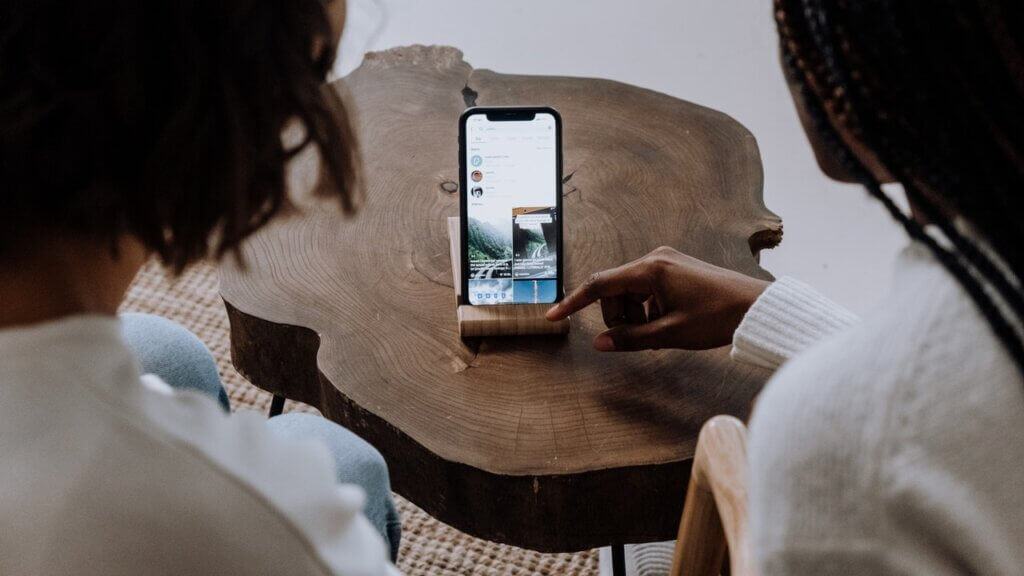 two people looking at travel destination online possibly via instagram