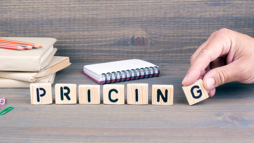 letters spelling out the word pricing. A critical component of the hotel revenue management strategy.