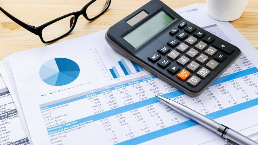 calculator and balance sheet reflecting importance of flow-through of hotel profit to the bottom line