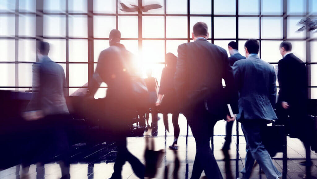 men and women in airport on business travel