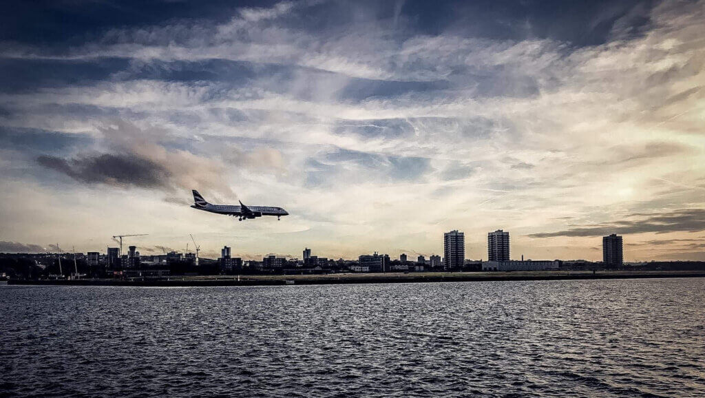 plane landing at airport reflecting increase in air travel