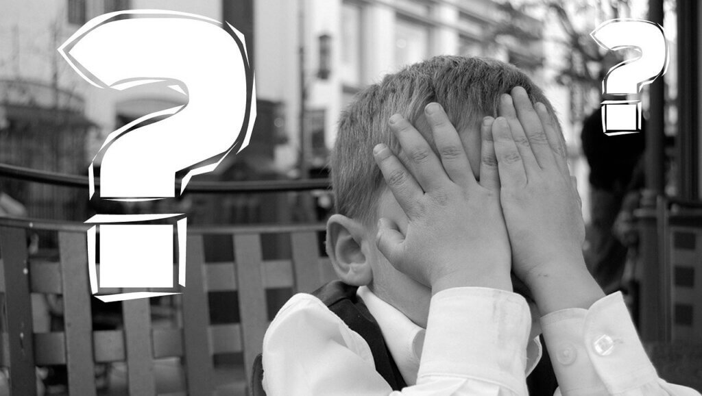 boy with head in hands and question marks asking the question is your hotel revenue management strategy working