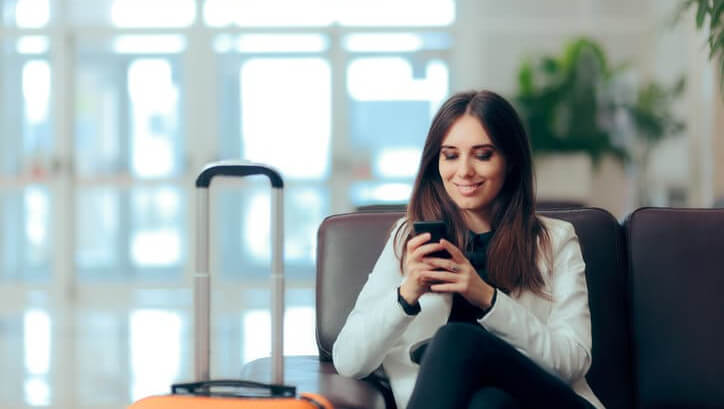 hotel woman guest on a mobile