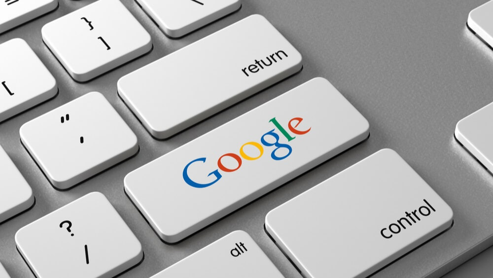 word google on a keyboard button reflecting dominance of the internet giant in hotel metasearch