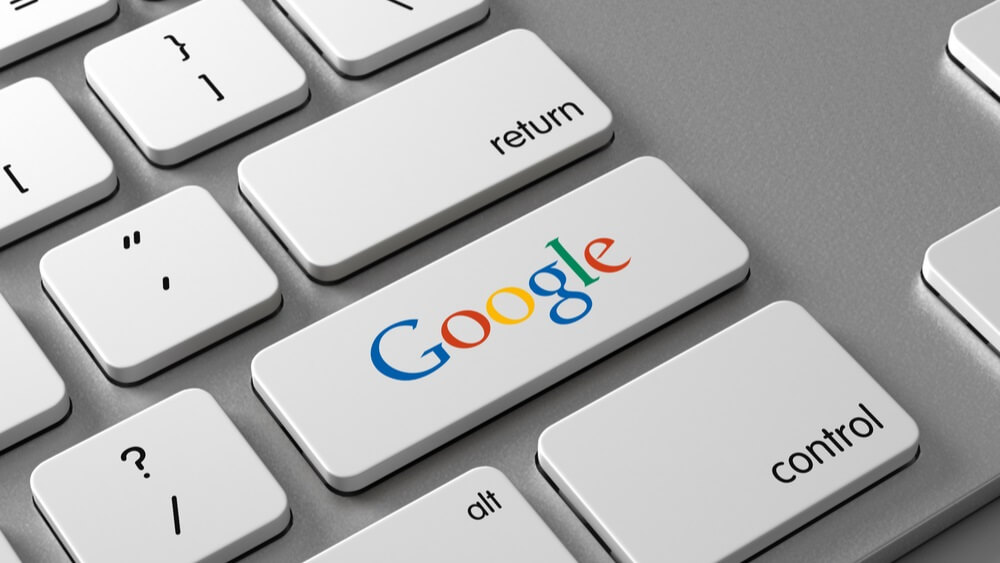 google written on a laptop key reflecting their new travel feeds in search ads and how it will impact hotels