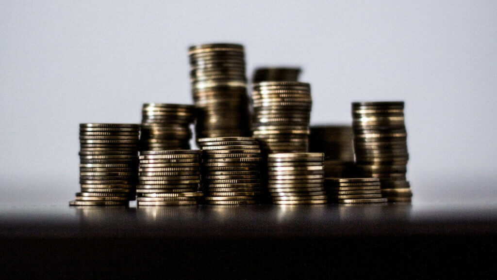 coins stacked up reflecting how hotels can be greedy about pricing at the end of 2021