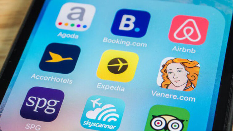 icons on mobile phone including well known otas expedia and booking reflecting proliferation of options beyond hotel direct bookings