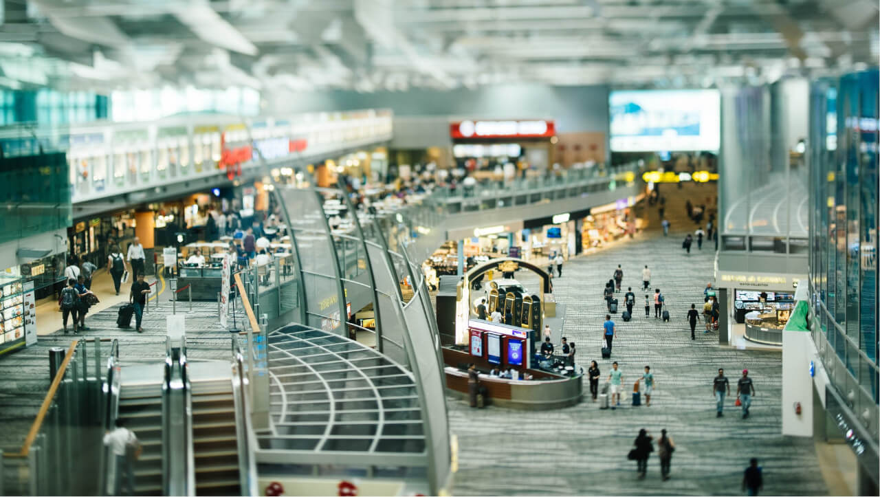 quiet airport terminal reflecting impact of business travel decline