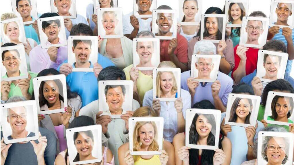 people holding up faces reflecting different personas