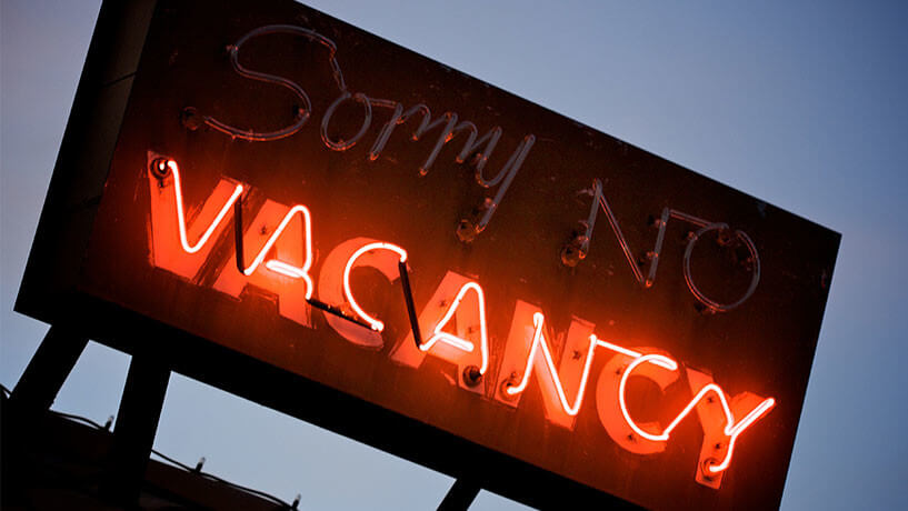 neon hotel vacancy sign reflecting need for hotels to develop a strong hotel sales strategy to boost occupancy and revenue