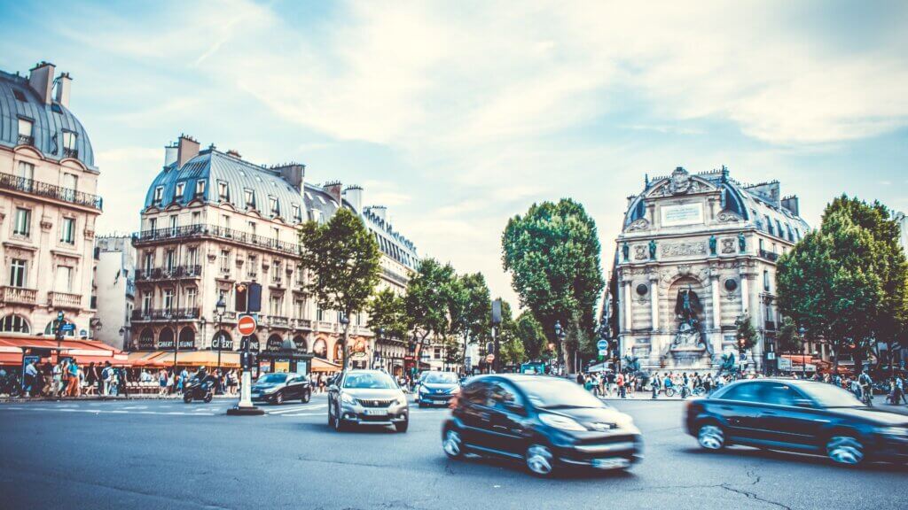 paris destination scene with intersection, hotel and shop fronts