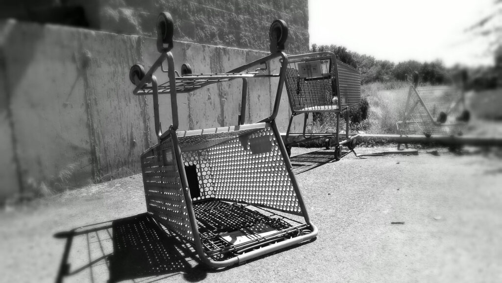 shopping cart tipped up on the side reflecting hotel online booking abandonment