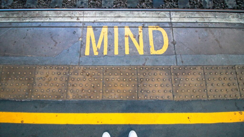 yellow line and the word mind reflecting mind the gap on the train lines and how this can apply to hotel service delivery and disconnect with guest experience