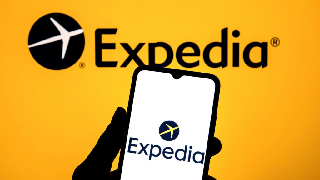 expedia logo in background and on mobile phone
