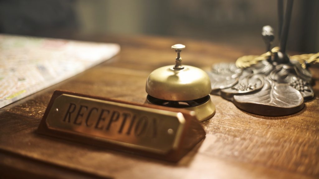 hotel reception sign and bell