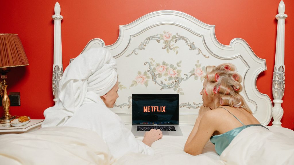 two ladies at a hotel room looking at netflix reflecting importance of guest personalized experiences