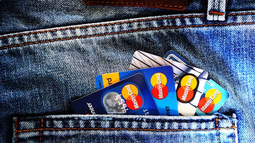 credit cards in a back pocket reflecting the risk hotels face because of increasing credit card fraud