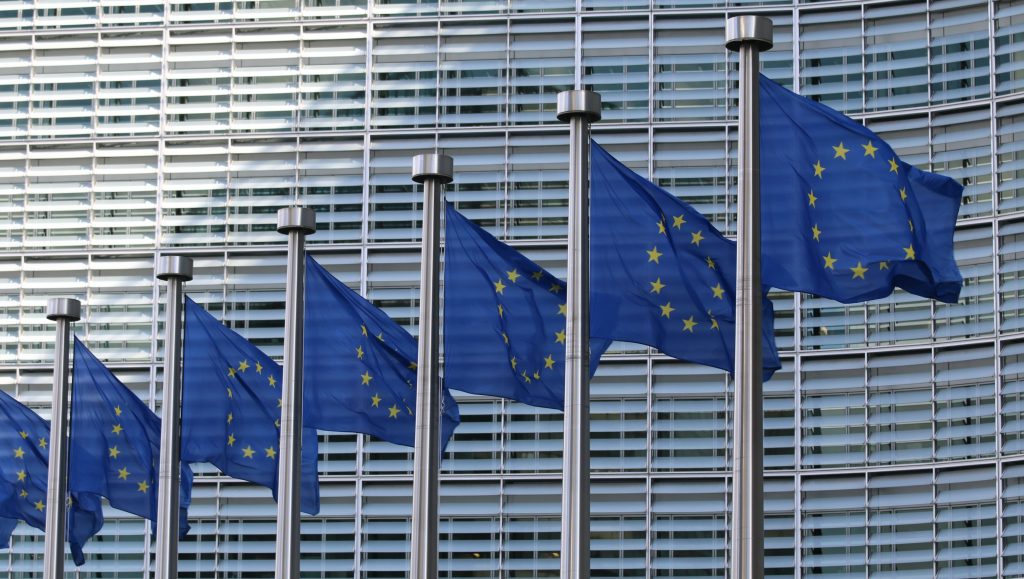 european union flags reflecting the importance of the eu new digital id as a potential game changer for hotels and guest experience
