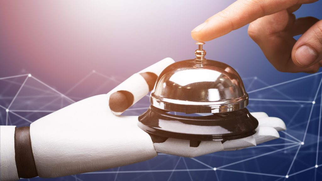 hotel reception bell being held by a robot reflecting the confusion between guest personalization and what it is and what it is not