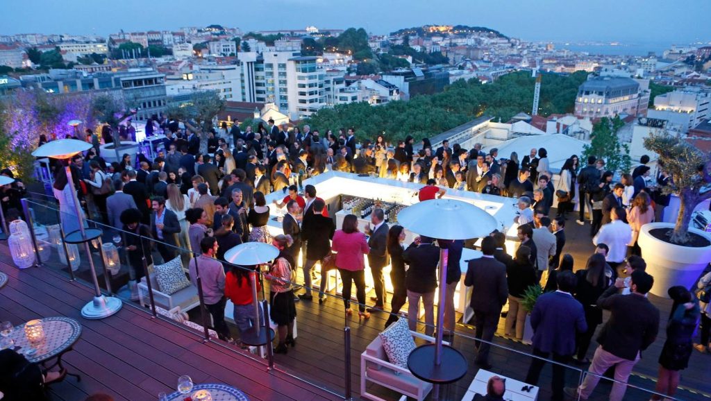 groups of people meeting on a hotel roof top location enjoying the summer weather