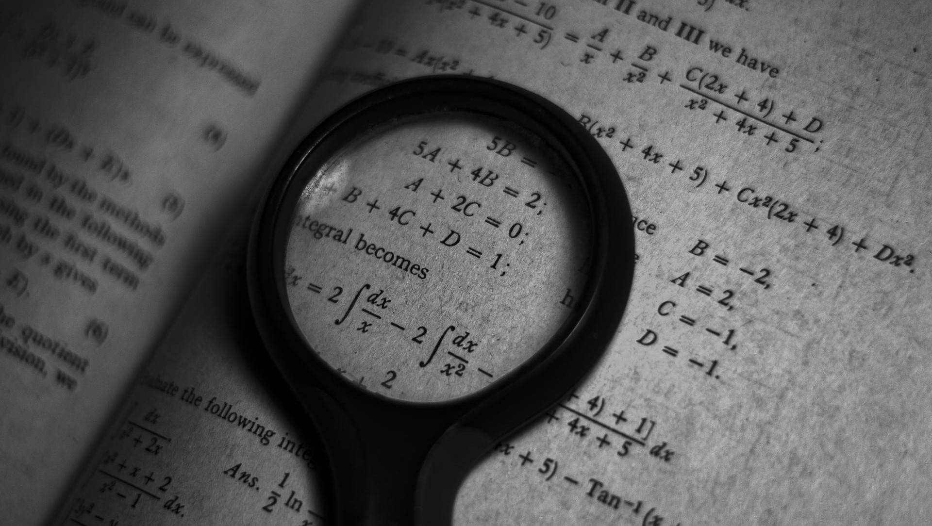 magnifying glass over an algorithm reflecting the problem with perfection and how over optimization can harm your revenue strategy