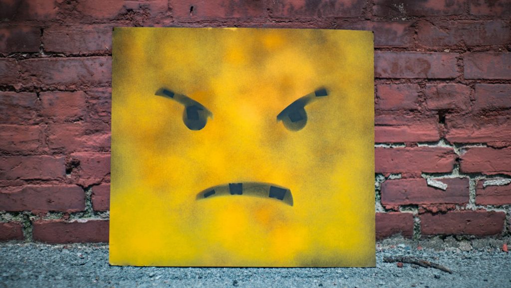 angry face reflecting how poorly managed guest conflict can lead to negative online reviews