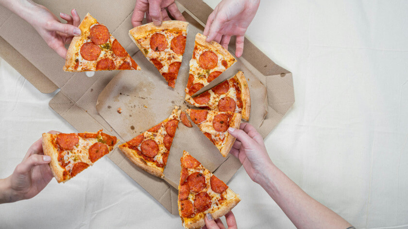 people taking pizza slices much like hotels have to try and secure their fair share of demand