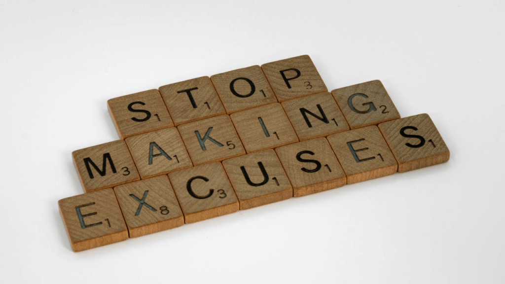 wooden tiles spelling out the words stop making excuses illustrating the many ways hoteliers justify challenges when handling their financial expenses and payrolls