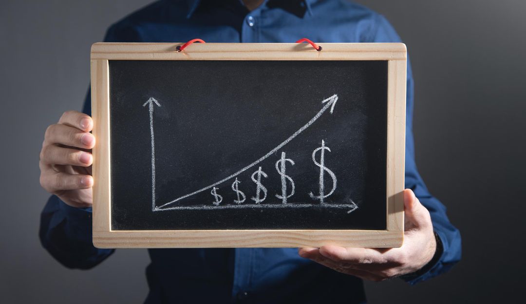 a graph going upwards with dollar signs underneath illustrating how hotel marketing can drives revenue beyond the initial reservation