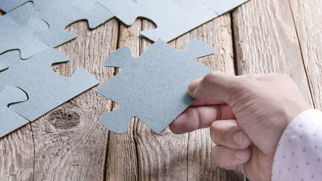 bookboost article image of someone holding a jigsaw piece reflecting the importance for hotels to leverage the guest journey to drive greater revenue performance