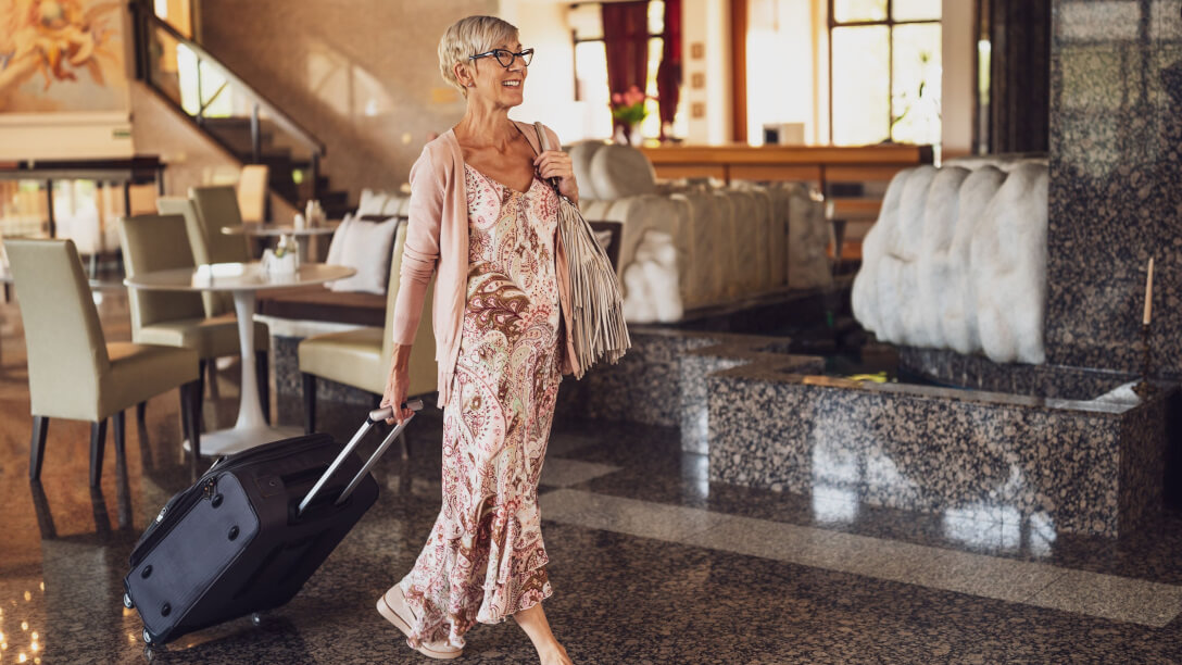 smiling lady in a hotel illustrating guest loyalty in 2025 for a bookboost article