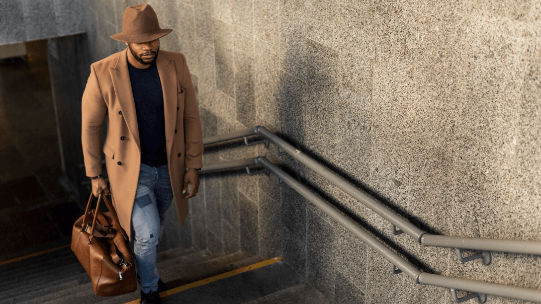 man walking up stairs maybe having left a hotel reflecting the importance of timing when trying to build loyalty with former guests